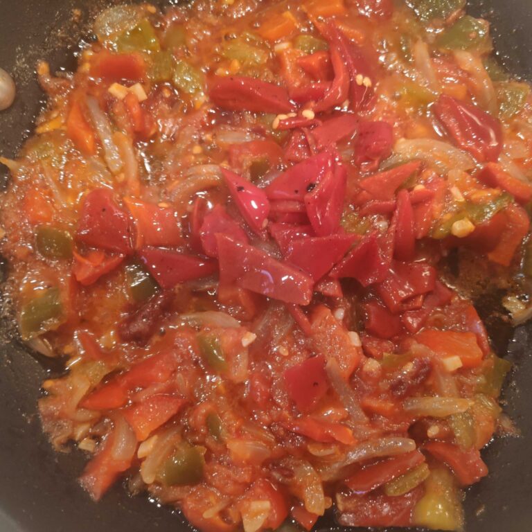 a la paella elaboració de l'ajoarriero, pebrots etc.